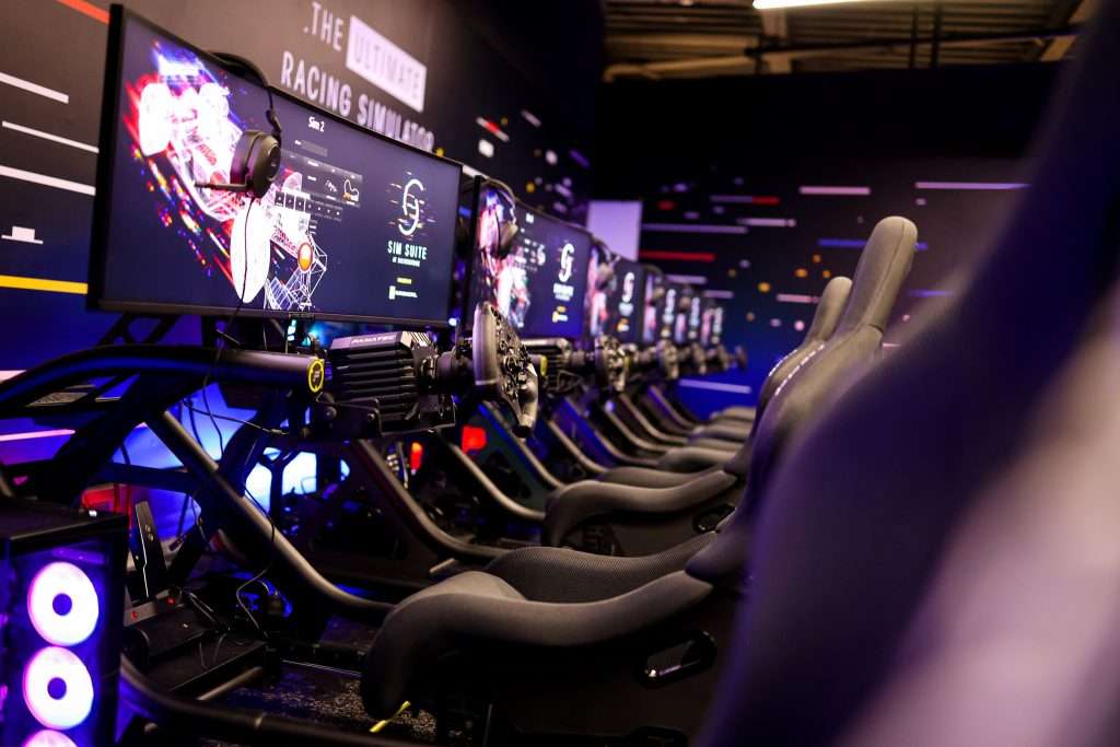 A row of racing simulators at the Silverstone SimSuite.